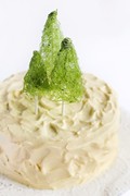 Coconut cake with spun sugar Christmas trees