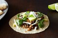 Coconut-lime pork tacos with black beans and avocado