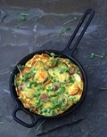 Golden frittata with potatoes, peas, and Parmesan