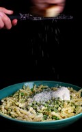 Pasta with basil-arugula pesto, peas, ricotta, and Parmesan