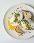 Poached eggs and Parmesan cheese over toasted brioche with pistou