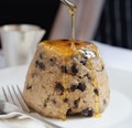 Spotted dick with butter, golden syrup and custard