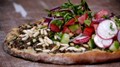 Turkish pizza with spicy minced beef and salad topping (Lahmacun)